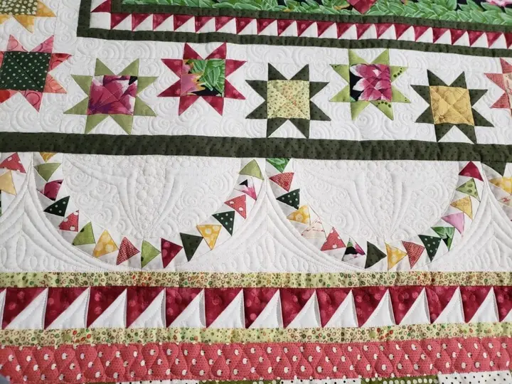 Traditional star sampler quilt in red, navy and cream